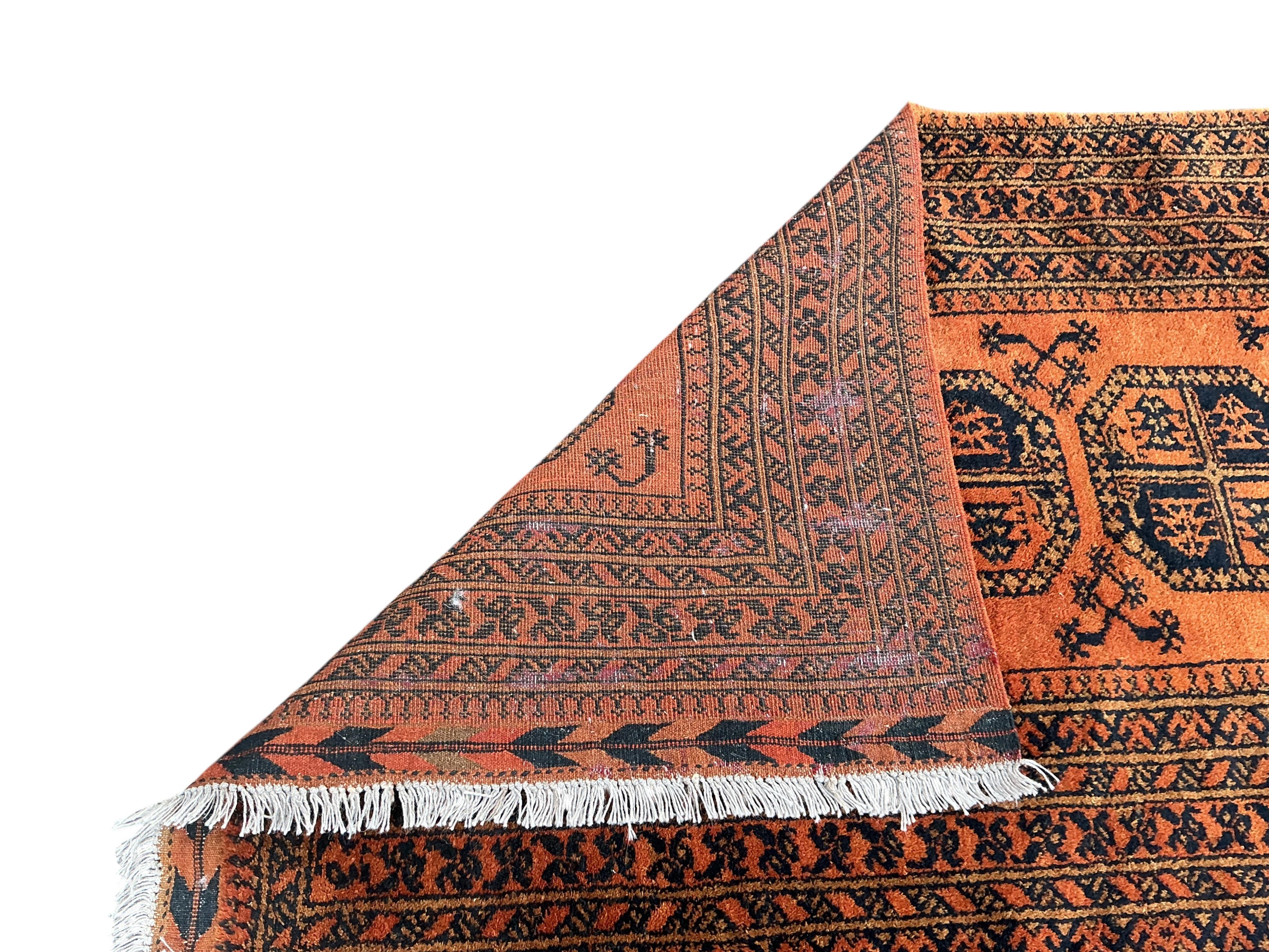 A Belouch red ground rug and an Afghan rug, 180 x 100cm and 155 x 105cm